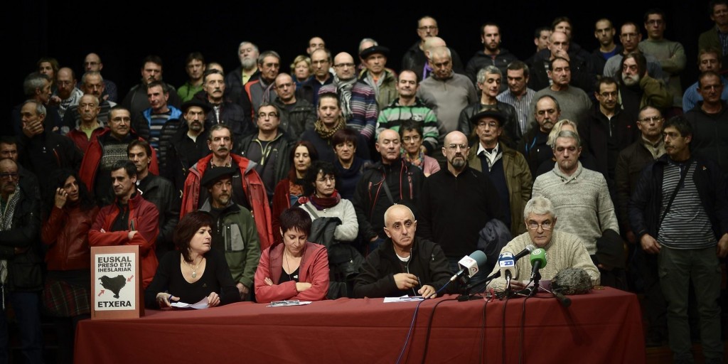 (Bottom L-R) Recently released ETA prisoners Itziar Martinez, Arantza Garballo, Estanis Etxeguren and Antxon Lopez address a meeting alongside released prisoners in Durango, January 4, 2014. Members of armed Basque separatist organization ETA, released from prison following a ruling by the European Court of Human Rights, met in Durango on Saturday to analyze last week's announcement by ETA prisoners association EPPK, to allow for non collective bargaining for release dates, according to local media. REUTERS/Vincent West (SPAIN - Tags: POLITICS CIVIL UNREST)